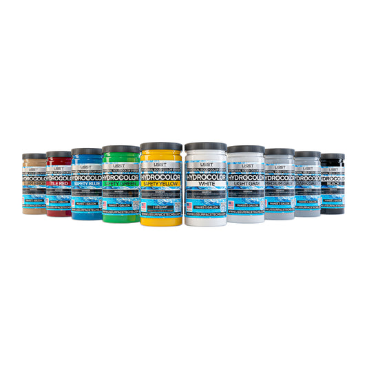 HydroColor epoxy pigment color chart showing all 10 solid floor colors including White, Warm Beige, Tile Red, Safety Yellow, Safety Green, Black, Safety Blue, Light Gray, Medium Gray, and Dark Gray.